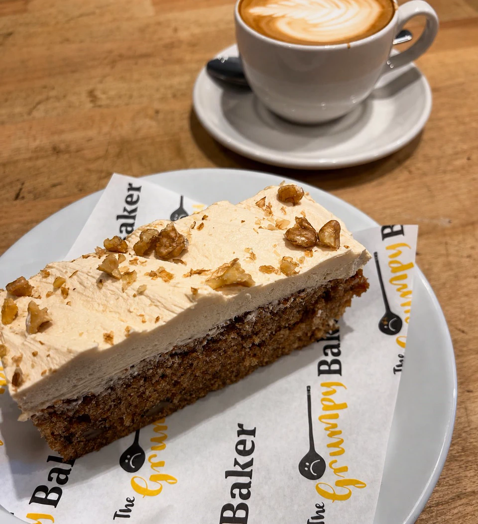 A slice of baked cake with coffee