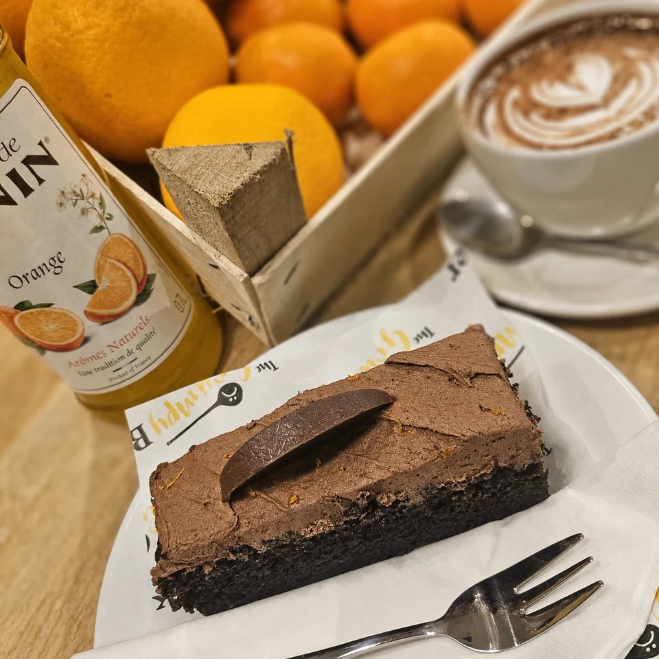 A dark iced cake with coffee