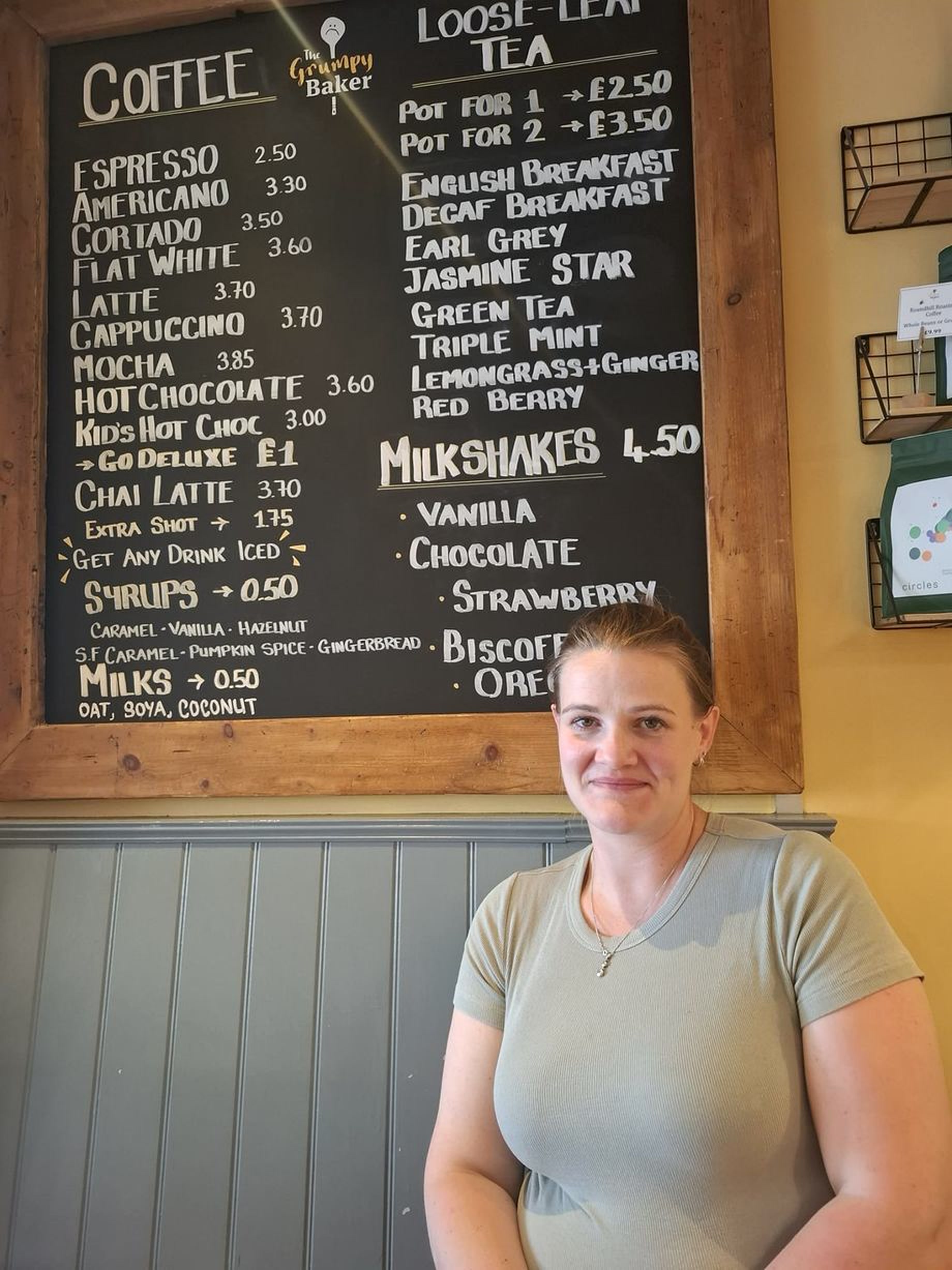 Hannah Turner beside The Grumpy Baker drinks board